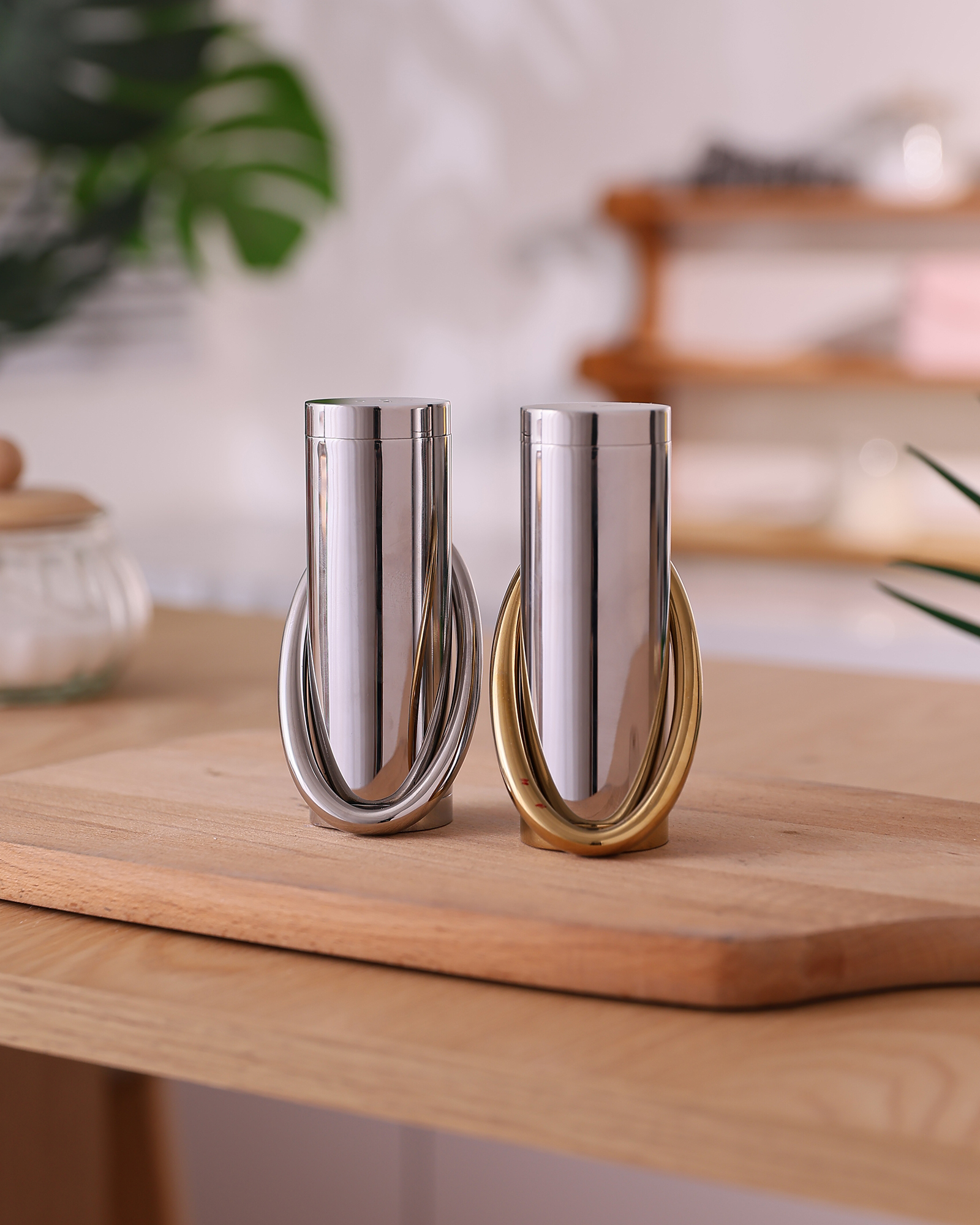 Kitchen tools styled on a warm wood surface